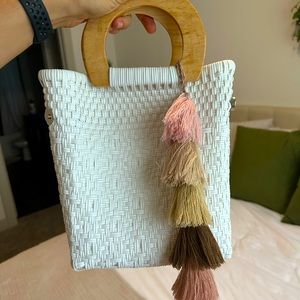 White purse with tassel